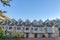 Apartment building with dormer roofs and sliding glass doors in San Francisco, California