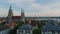 Apartment buildings and large catholic church in urban borough. Oktoberfest site with high capacity beer tents and