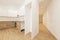 Apartment with chestnut wood furniture, white kitchen in the upper part,