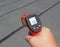 Apartment rooftop summer temperature on a block probed with an infrared thermometer