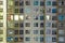 Apartment windows at night in new condo highrise building full o