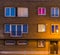 Apartments complex lighted by night, Belgian homes, building exterior with windows and front door