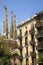 Apartments in foreground with view of Sagrada Familia Holy Family Church by architect Antoni Gaudi, Barcelona, Spain begun in