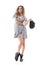 Apathetic indifferent bored young stylish woman in summer dress looking up holding cap