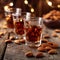 Aperitif moment Shot glasses with amaretto liqueur and almonds on table