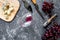 Aperitive parmesan cheese, cheese with blue mould and red grape on grey stone table background top view