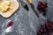 Aperitive parmesan cheese and red grape on grey stone table background copyspace top view