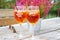 Aperol drinks on outdoor table in restaurant garden