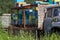 Apiary with beehives on a car platform in the field. Mobile apiary with hives on wheels. Honey is a useful natural