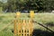 Apiary on field behind wooden fence