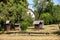 An apiary with old wooden hives in a rural garden.