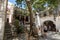 Apiranthos, Naxos / Greece - July 13, 2019: Toutists visiting the narrow streets and shops of Apiranthos