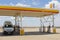 Apollo camper van at a Shell gas station in the Outback, Australia