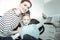 Appealing attentive mother and her active daughter sitting in dentist cabinet