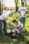 Appealing three volunteers sitting tree