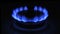 The appearance of a blue flame of gas. Gas stove on a black background
