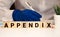 APPENDIX word made with wooden blocks concept