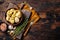 Appetizer Artichoke hearts pickled in olive oil with herbs and spices Wooden background. Top view. Copy space