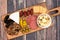 Appetizer board over a wooden background