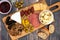 Appetizer board over a wooden background