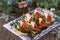 Appetizer canape on crispy bread with cucumber, carrots and sausage. Beautiful Christmas and New Year`s food background.