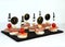 Appetizer canape with ham, cream cheese, salmon and cherry tomato on bamboo skewers with new year decor