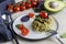 Appetizer Italian pasta with pesto and cherry tomatoes