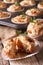 Appetizer muffins with ham and cheese close-up. Vertical