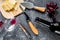 Appetizer parmesan cheese and red grape on grey stone table background top view