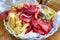 Appetizer platter with various cheeses, salami, ham