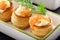 Appetizer puff pastry with dill dip and salmon