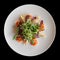 Appetizer with salmon, artichokes and lettuce shot from above, isolated