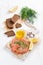 Appetizer - salted salmon, bread and ingredients on a board