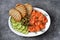 Appetizer - salted salmon, pieces of cucumber, capers, dill and grilled bread. Top view,