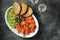 Appetizer - salted salmon, pieces of cucumber, capers, dill and grilled bread. Top view,