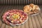 Appetizer Savory Dish With Leavened Pitta Flatbread Loaves And Baguette Slices Set On Rustic Bamboo Place Mat