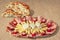 Appetizer Savory Dish Meze And Leavened Pitta Flatbread Torn Loaf Set On Striped Brown Kraft Paper Background