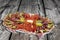 Appetizer Savory Dish Set On Old Knotted Cracked Wooden Picnic Table Grunge Surface