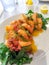 Appetizer shrimp tacos with mango sauce.