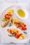 Appetizer. Slices of bread, cream cheese and grilled bell pepper with olive oil