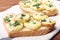 Appetizer of wheat bread, potatoes, cheese and green onions