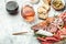 Appetizers with differents antipasti, snacks and wine. Meat antipasto platter. Sausage, ham, tapas, olives. banner, menu, recipe