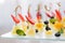 Appetizers, gourmet food - canape with cheese and strawberries, blue-berries catering service. selective focus, top view