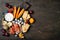 Appetizers table with italian antipasti snacks. Cheese and charcuterie variety board over rustic wooden background.