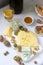 Appetizers of various types of cheese, grapes, nuts and honey, served with white and red wine. Rustic style