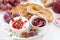 appetizers for wine - camembert with berry jam, toast and fruit