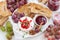 Appetizers for wine - camembert with berry jam, toast and fruit