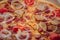 Appetizing background pepperoni pizza closeup filling the frame