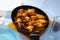 Appetizing baked chicken wings in plate closeup