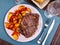 Appetizing beef entrecote with baked potatoes